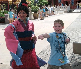 By supporting educational efforts at KFA you have enabled Daniel and his family to enjoy their Disney vacation without fear! Here he is teaching Mulan a front punch!